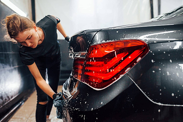 pngtree black car cleaned by woman at car wash photo image 51073590